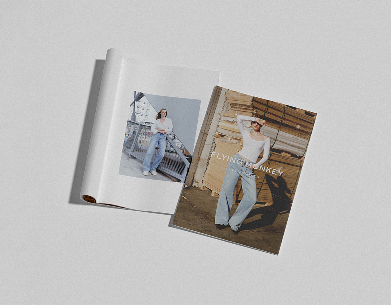 Two models wear Flying Monkey’s bestselling denim in a catalog-style lookbook, photographed in urban and industrial settings.